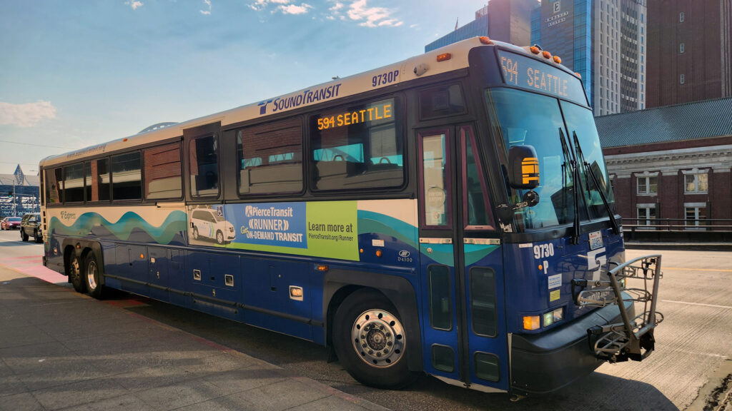 Blue, green, and black bus.