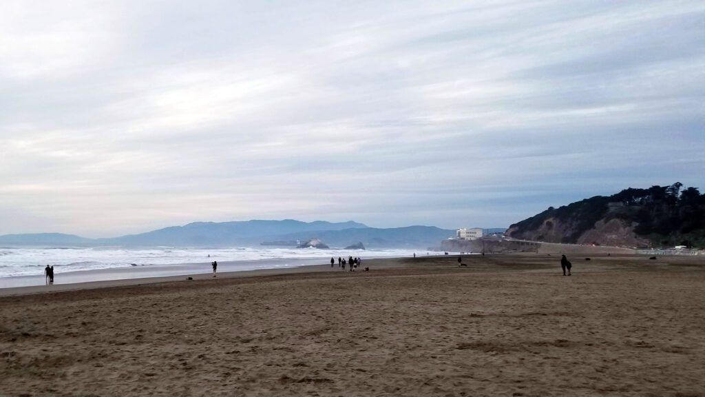 img_post_sf_oceanbeach_1920px - Vector+Vista Ocean Beach at dusk with Seal Rocks and the Sutro Baths bluffs visible in the distance, near where the Golden Gate Dozen Trail transitions from Lands End onto the Great Highway.
